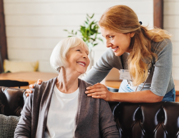 Middle,Aged,Nurse,Taking,Care,Of,Old,Woman,Indoors.,Caregiver